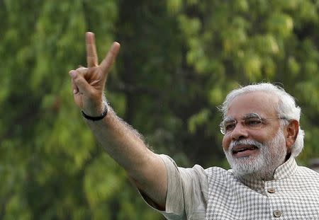 Hindu nationalist Narendra Modi, the prime ministerial candidate for India's main opposition Bharatiya Janata Party (BJP), gestures during a public meeting in Vadodra, in the western Indian state of Gujarat May 16, 2014. REUTERS/Amit Dave