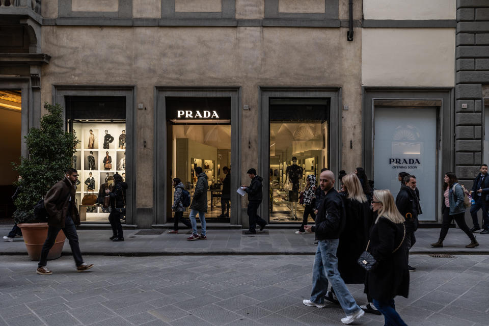FLORENCE, ITALY - FEBRUARY 29: People walk past Italian luxury fashion house Prada's retail store on February 29, 2024 in Via de' Tornabuoni, Florence, Italy. The historic centre of Florence, birthplace of the Renaissance, attracts more than 10 million tourists every year and was named a World Heritage Site by UNESCO in 1982. (Photo by Emanuele Cremaschi/Getty Images)