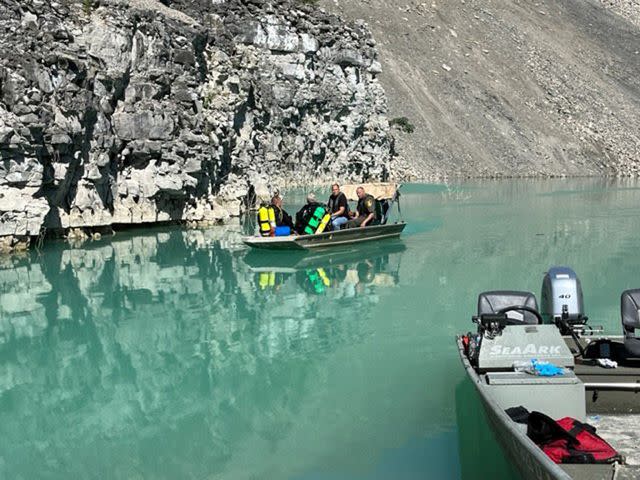 <p>Indiana DNR Division of Law Enforcement/Facebook</p> Authorities at the Indiana rock quarry where a dump truck fell into a water-filled pit on Tuesday