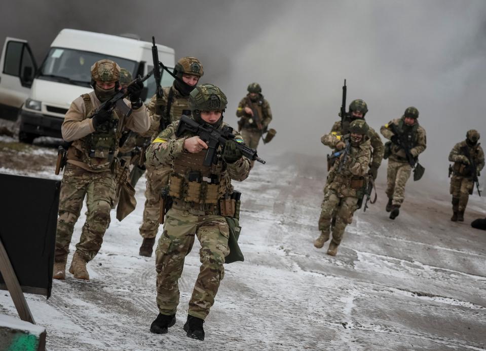 Ukrainian troops in joint drills of armed forces, national guard and Security Service of Ukraine near the border with Belarus (Reuters)