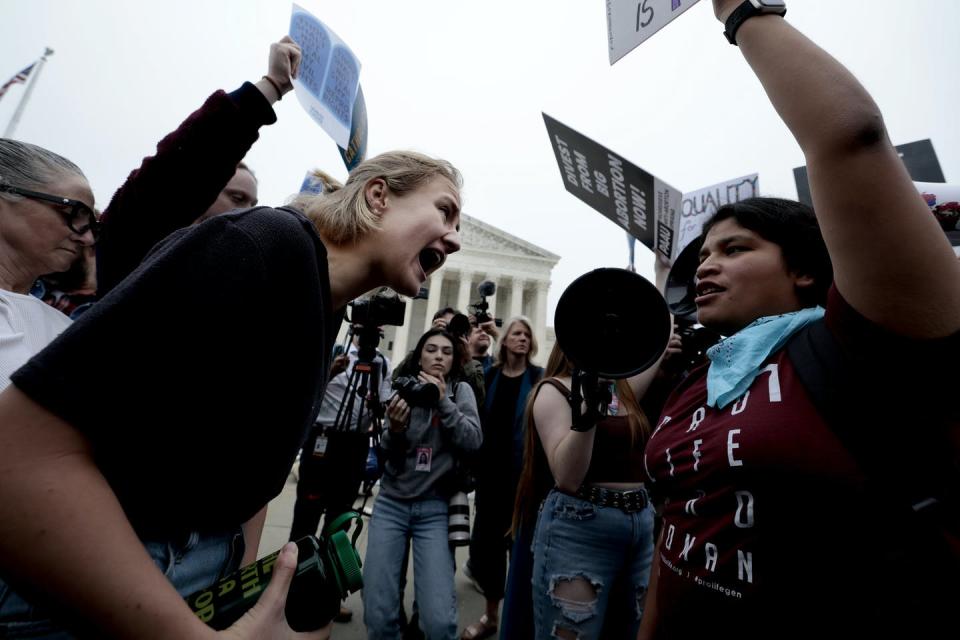 <span class="caption">Activists who oppose and support abortion rights clash outside the U.S. Supreme Court building.</span> <span class="attribution"><a class="link " href="https://www.gettyimages.com/detail/news-photo/pro-choice-and-anti-abortion-activists-demonstrate-in-front-news-photo/1395164177?adppopup=true" rel="nofollow noopener" target="_blank" data-ylk="slk:Anna Moneymaker/Getty Images;elm:context_link;itc:0;sec:content-canvas">Anna Moneymaker/Getty Images</a></span>