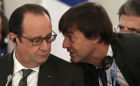 French President Francois Hollande (L) speaks with French environmental activist and special envoy for the protection of the planet Nicolas Hulot as they attend "The Climate Challenge and African solutions" event during the World Climate Change Conference 2015 (COP21) at Le Bourget, near Paris, France, December 1, 2015. REUTERS/Philippe Wojazer