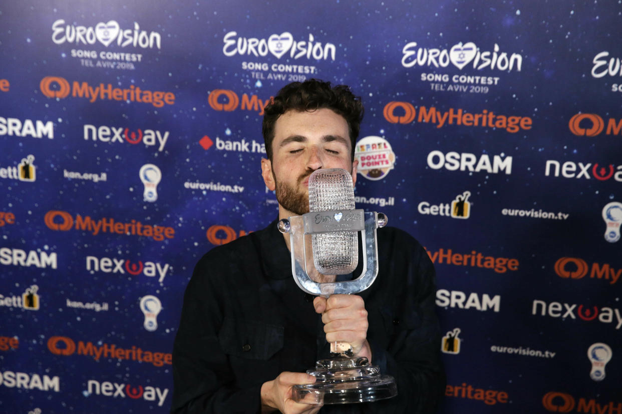 Duncan Laurence of the Netherlands celebrates with the trophy during a press conference after winning the 2019 Eurovision Song Contest grand final with the song "Arcade" in Tel Aviv, Israel, Saturday, May 18, 2019. (AP Photo/Sebastian Scheiner)