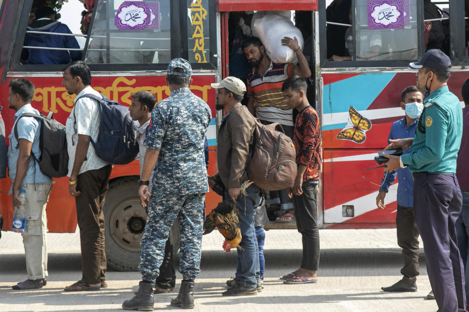 Rohingya refugees arrive at the Chittagong boat club to board naval vessels that will take them to Bhasan Char island, in Chittagong, Bangladesh, Thursday, Nov. 25, 2012. Thousands have been relocated on the island in the Bay of Bengal from crammed camps near the Myanmar border. (AP Photo)