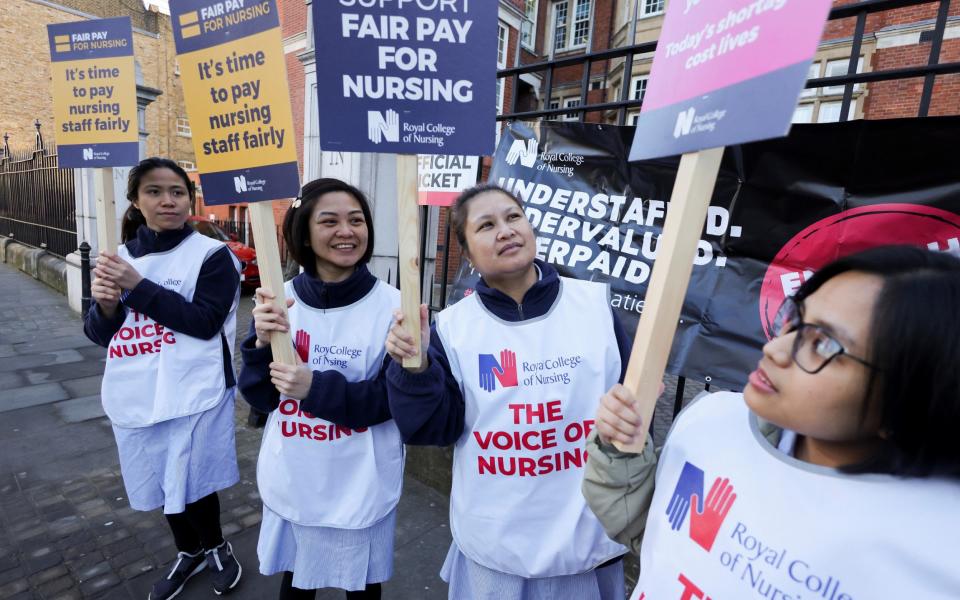 Nurses protest at a picket line outside the Royal Marsden Hospital in London this morning - Kevin Coombs/Reuters