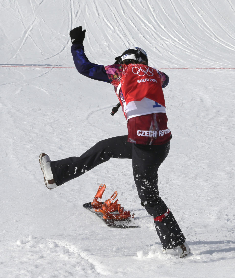 Czech Republic's Eva Samkova celebrates after taking the gold medal in the women's snowboard cross final at the Rosa Khutor Extreme Park, at the 2014 Winter Olympics, Sunday, Feb. 16, 2014, in Krasnaya Polyana, Russia. (AP Photo/Andy Wong)