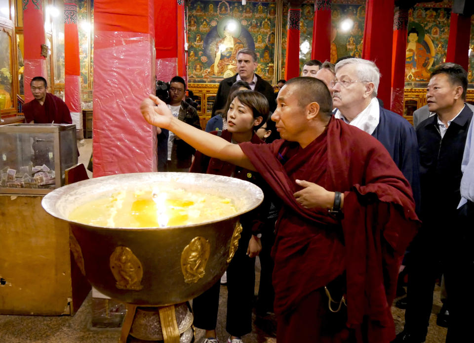 In this photo taken May 22, 2019, and released by the U.S. Embassy in Beijing, U.S. Ambassador to China Terry Branstad, second from right, visits the Sera Monastery in Lhasa in western China's Tibet Autonomous Region. The U.S. ambassador to China made a rare visit to Tibet this week to meet local officials and raise concerns about restrictions on Buddhist practices and the preservation of the Himalayan region's unique culture and language. (U.S. Mission to China via AP)