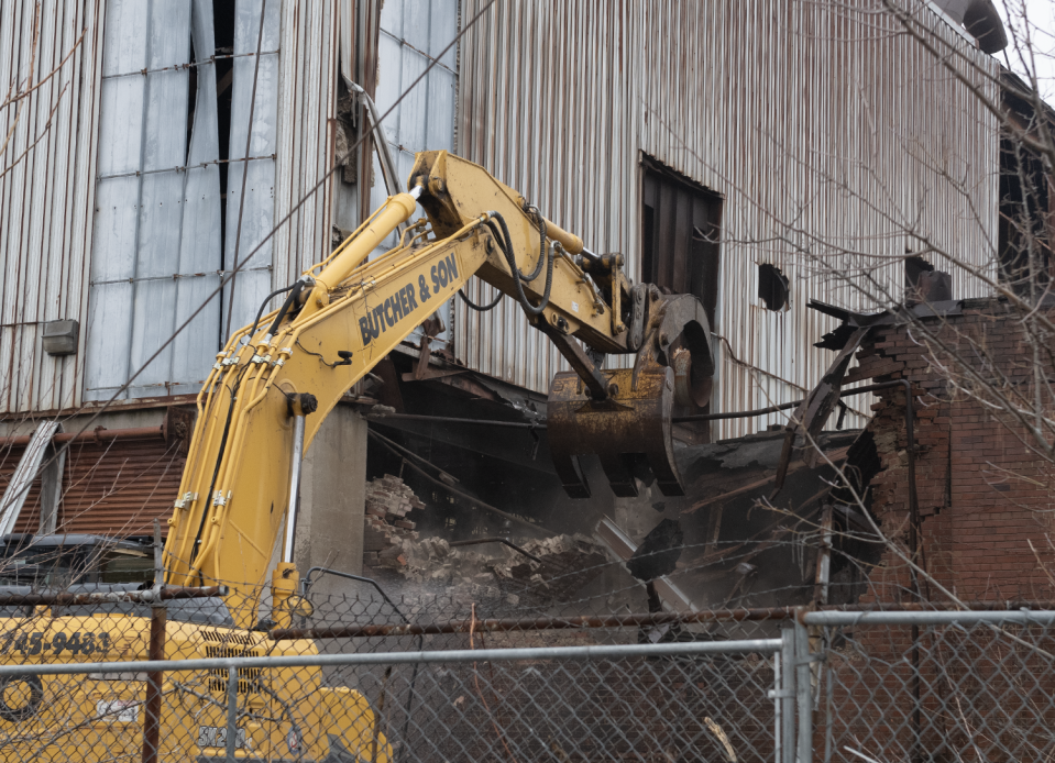 Demolition work gets underway Thursday at the former Atlantic Foundry Co. complex along Annadale Avenue in Akron. The project will take months to complete.