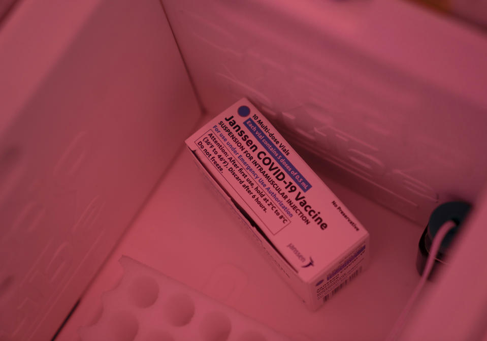 A box containing the Johnson & Johnson's COVID-19 vaccine sits in a cooler at a Cedars-Sinai sponsored pop-up vaccine clinic at the Watts-Willowbrook Boys & Girls Club in Los Angeles, Wednesday, April 28, 2021. California, swimming in vaccine, is in a far different place than it was just weeks ago when simply scoring an appointment was cause for celebration. Today, Los Angeles, San Diego and other populous counties are advertising that anyone can walk in for a shot and the state is texting reminders that plenty of appointments are available. (AP Photo/Jae C. Hong)