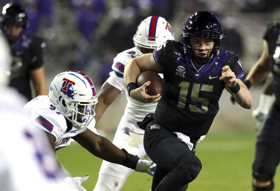 TCU quarterback Max Duggan (15) carries the ball against Louisiana Tech in the first half during an NCAA college football game, Saturday, Dec. 12, 2020. (AP Photo/Richard W. Rodriguez)