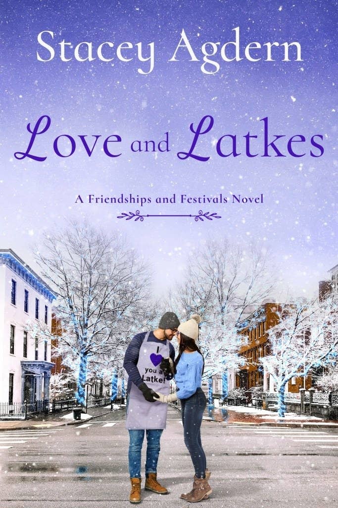 A white man, wearing an apron that says 'I heart you a latke," and a white woman stand together on a snow covered street. The title reads: Love and Latkes. Below says, "A Friendships and Festivals Novel."