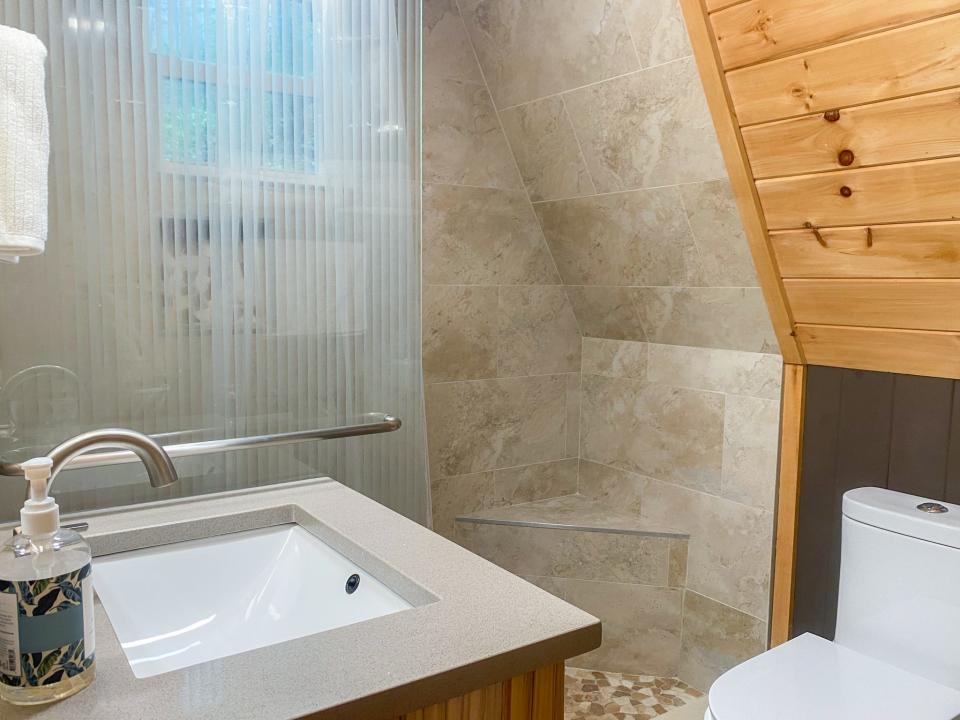 Bathroom, Joey Hadden, " I spent 2 nights in a cozy A-frame cabin for the first time while visiting the Great Smoky Mountains"