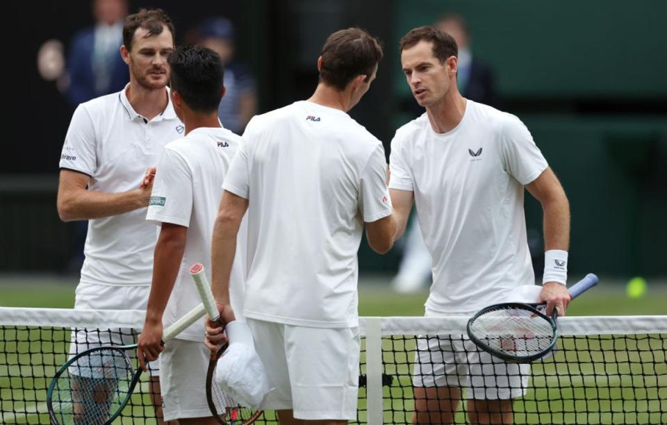 The Murray brothers shake hands with Rinky Hijikata and John Peers after the Australian pair’s straight-sets victory (Getty)