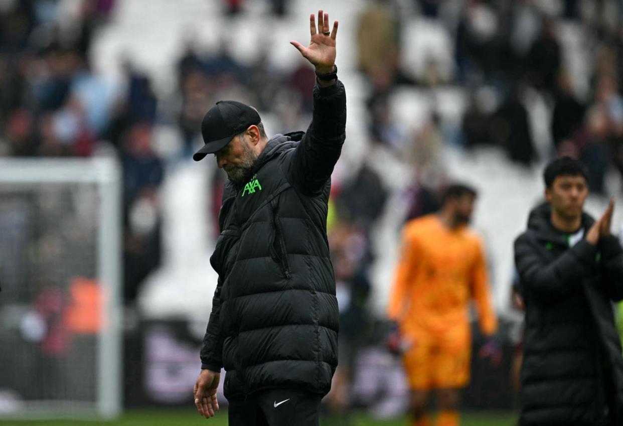 <span>Jürgen Klopp waves to the LIverpool fans after their 2-2 draw with West Ham.</span><span>Photograph: Ben Stansall/AFP/Getty Images</span>