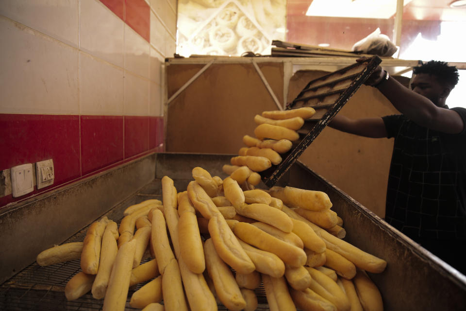 A man works in a bakery in Khartoum, Sudan, Wednesday, March.30, 2022. The UN has warned that more than 18 million people Sudanese, nearly half its population, could face severe hunger by this fall. (AP Photo/Marwan Ali)