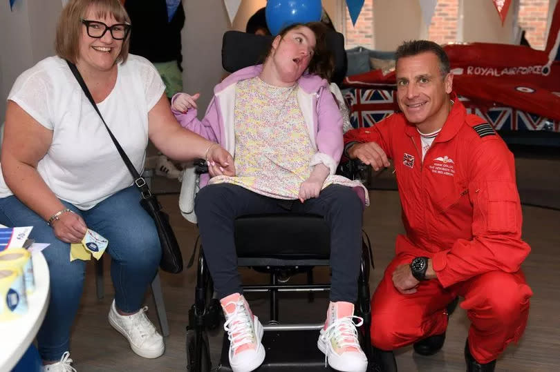 Lilly-Rose Robinson, 15 with Mum Claire Robinson and the Red Arrows RAF Acrobatic Team's Adam Collins -Credit:Donna Clifford/GrimsbyLive