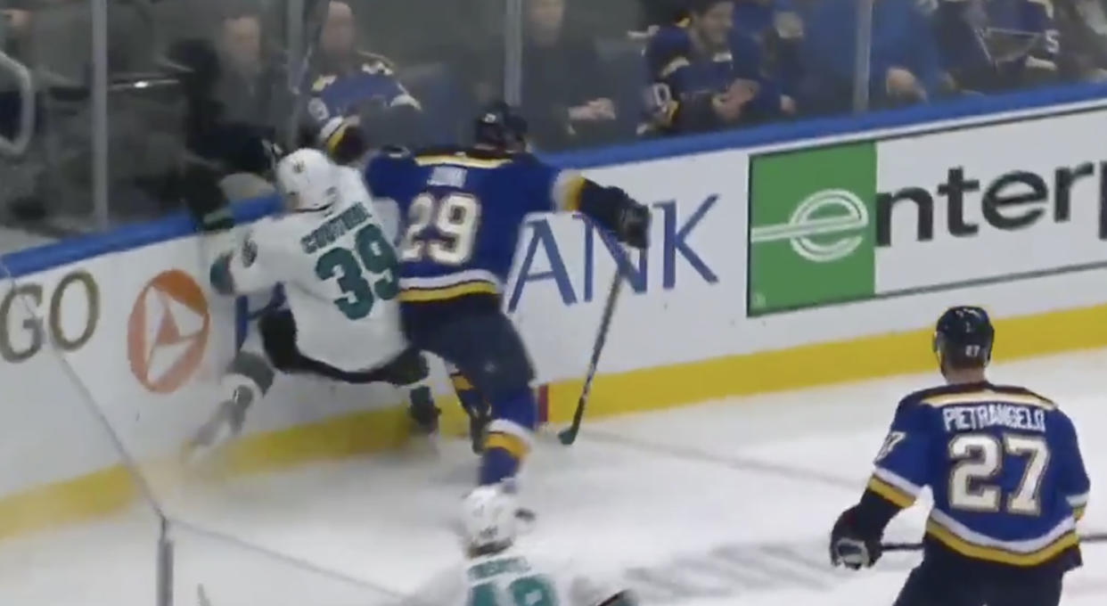 Sharks captain Logan Couture went into the end boards awkwardly while battling for a puck with Blues defenceman Vince Dunn on Tuesday. (Twitter//@NBCSSharks)