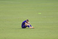 Orlando City forward Chris Mueller (9) sits on the pitch after an MLS playoff soccer match against the New England Revolution, Sunday, Nov. 29, 2020, in Orlando, Fla. (AP Photo/Matt Stamey)