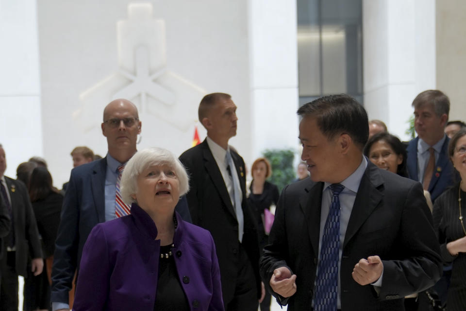 U.S. Treasury Secretary Janet Yellen, left, walks with Governor of the People's Bank of China Pan Gongsheng as they meet at the People's Bank of China in Beijing Monday, April 8, 2024. (AP Photo/Tatan Syuflana, Pool)