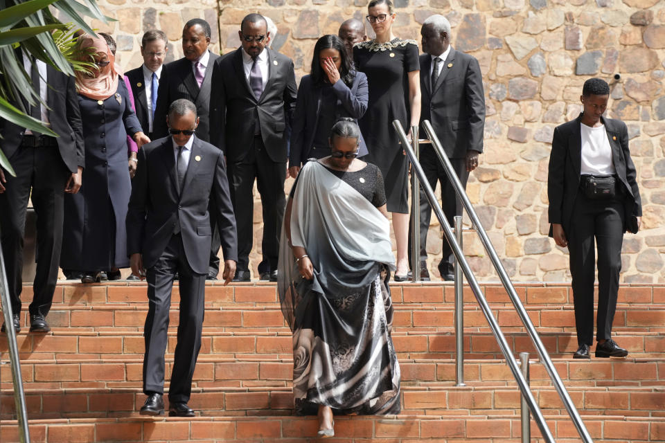 Rwandan President Paul Kagame, left, and his wife, first lady Jeannette Kagame lead other dignitaries as they arrive for a ceremony to mark the 30th anniversary of the Rwandan genocide, held at the Kigali Genocide Memorial, in Kigali, Rwanda, Sunday, April 7, 2024. Rwandans are commemorating 30 years since the genocide in which an estimated 800,000 people were killed by government-backed extremists, shattering this small east African country that continues to grapple with the horrific legacy of the massacres. (AP Photo/Brian Inganga)