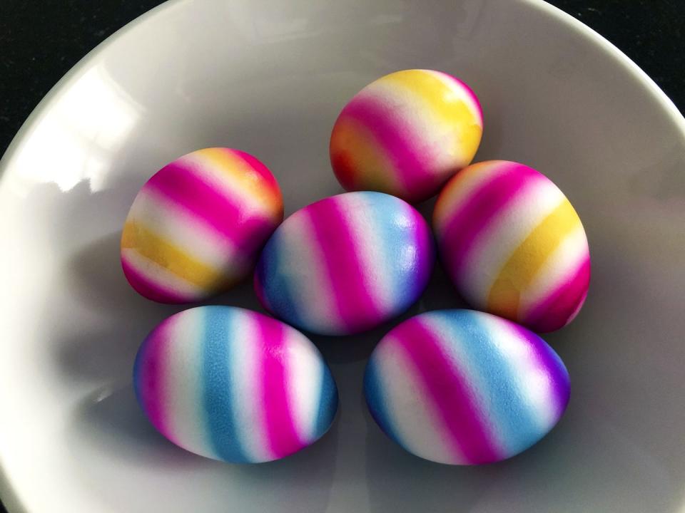 <p>Paint bands of color around the circumference of the eggs to create colorful patterns. Bleeding and feathering only adds to the look.</p>