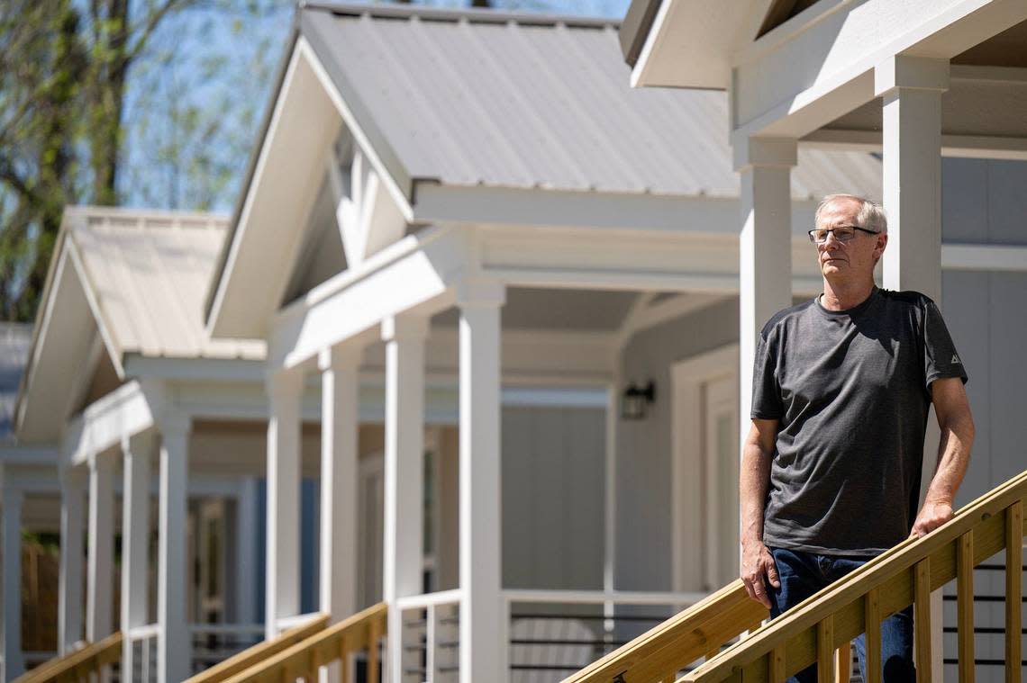 Phil Jorgenson, a longtime volunteer for Uplift, now secretary of Eden Village of Kansas City paused during a tour of the tiny homes.