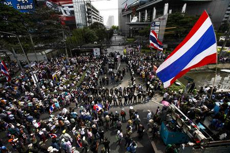 Anti-government protesters gather outside a business building owned by SC Asset Corp during a rally in Bangkok February 20, 2014. REUTERS/Athit Perawongmetha