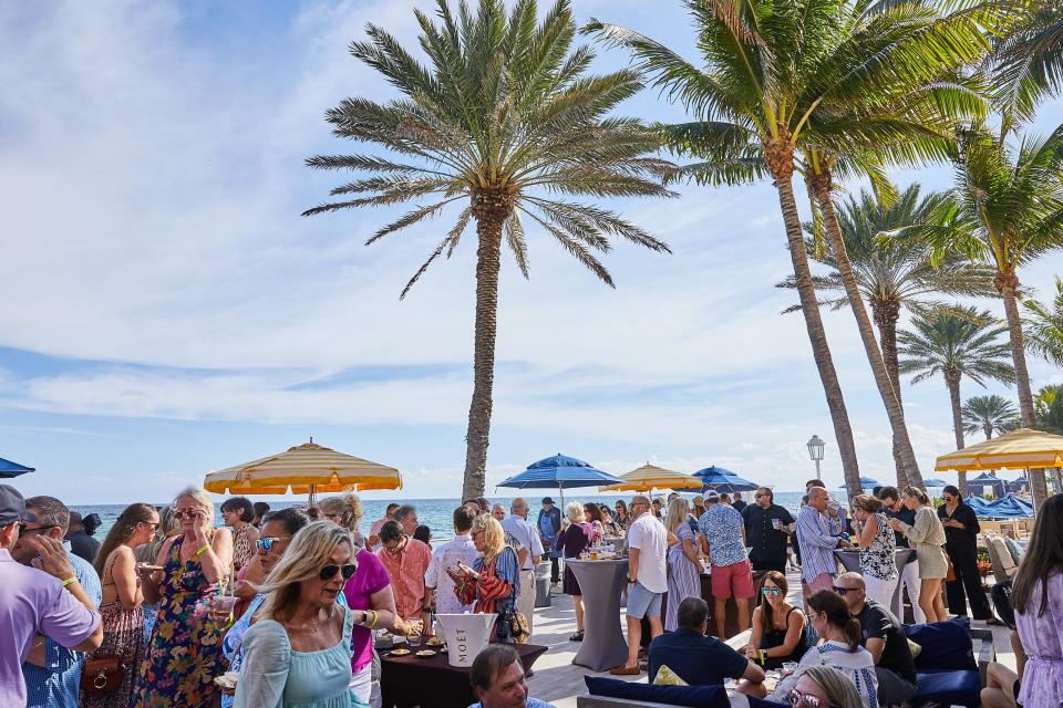 Guests gather at the 2021 Palm Beach Food and Wine Festival's "Grillin' n' Chillin'" cookout at the Eau Palm Beach resort. Tickets for the cookout are among the few still available for this year's festival.
