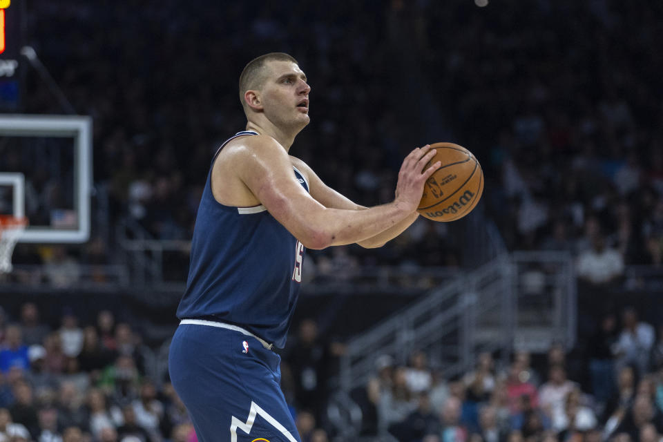 Denver Nuggets center Nikola Jokic looks to score against the San Antonio Spurs during the first half of an NBA basketball game, Friday, March 15, 2024, in Austin, Texas. (AP Photo/Stephen Spillman)