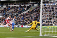 Brighton's Evan Ferguson, 3rd left, scores his side's third goal during the English FA Cup quarterfinals soccer match between Brighton & Hove Albion and Grimsby Town at the AMEX Stadium in Brighton, England, Sunday, March 19, 2023. (AP Photo/David Cliff)