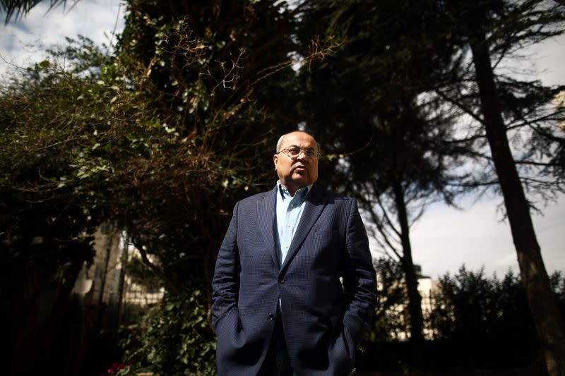 Arab politician Ahmad Tibi, of the Joint List party, gestures during his interview with Reuters at his house in East Jerusalem