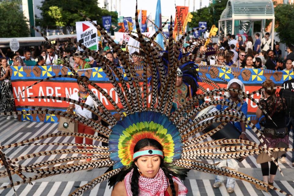 Activists say the number of spaces available to them in the vast Cop28 venue was ‘reduced’ after an early protest included messages of solidarity with Palestinians (Reuters)