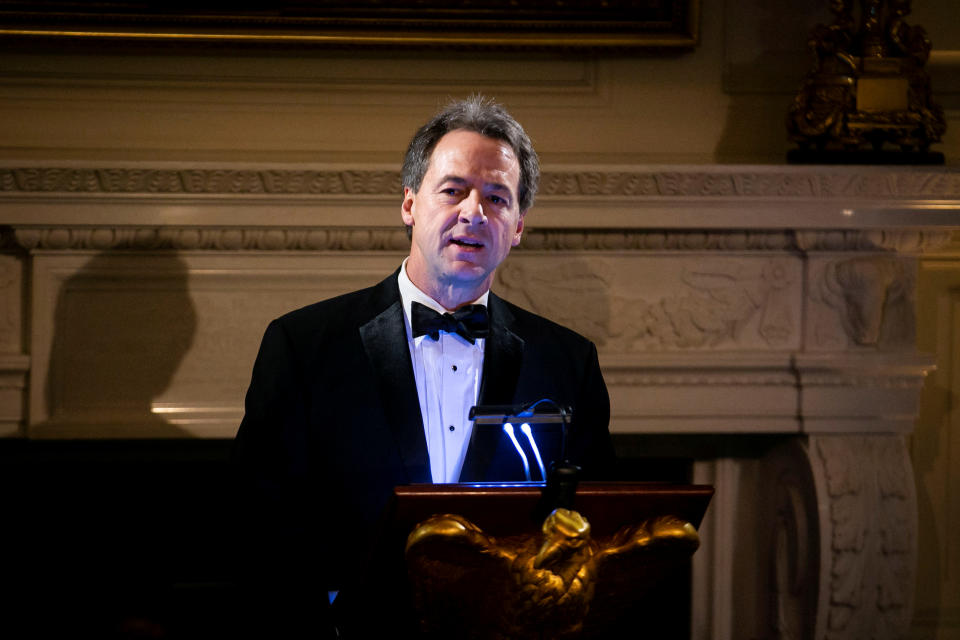 FILE PHOTO: Montana Gov. Steve Bullock gives a toast at the Governors' Ball, in the State Dining Room of the White House, in Washington, U.S., February 24, 2019. REUTERS/Al Drago/File Photo