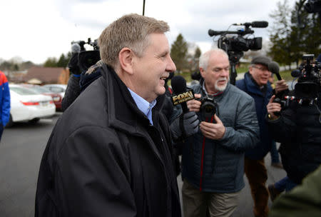 U.S. congressional candidate and State Rep. Rick Saccone navigates through the media to cast his vote in Pennsylvania's 18th U.S. Congressional district special election between Republican Saccone and Democratic candidate Conor Lamb at a polling place in McKeesport, Pennsylvania, U.S., March 13, 2018. REUTERS/Alan Freed