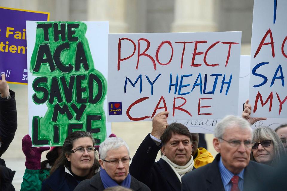 Supporters of the Affordable Care Act demonstrate outside the Supreme Court during oral arguments in 2015.