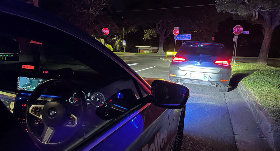 A photo of a NSW Police car stopping a VW Golf GTI in Rozelle.