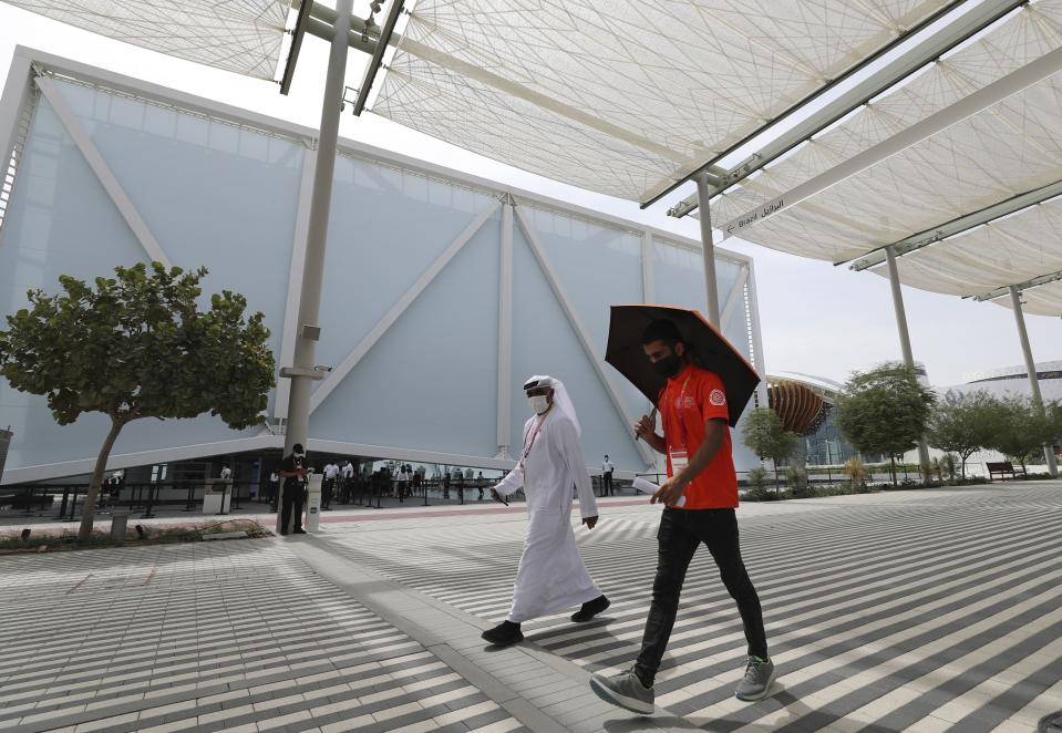 Visitors pass by the Brazil Pavilion at the Dubai Expo 2020, in Dubai, United Arab Emirates, Sunday, Oct, 3, 2021. (AP Photo/Kamran Jebreili)
