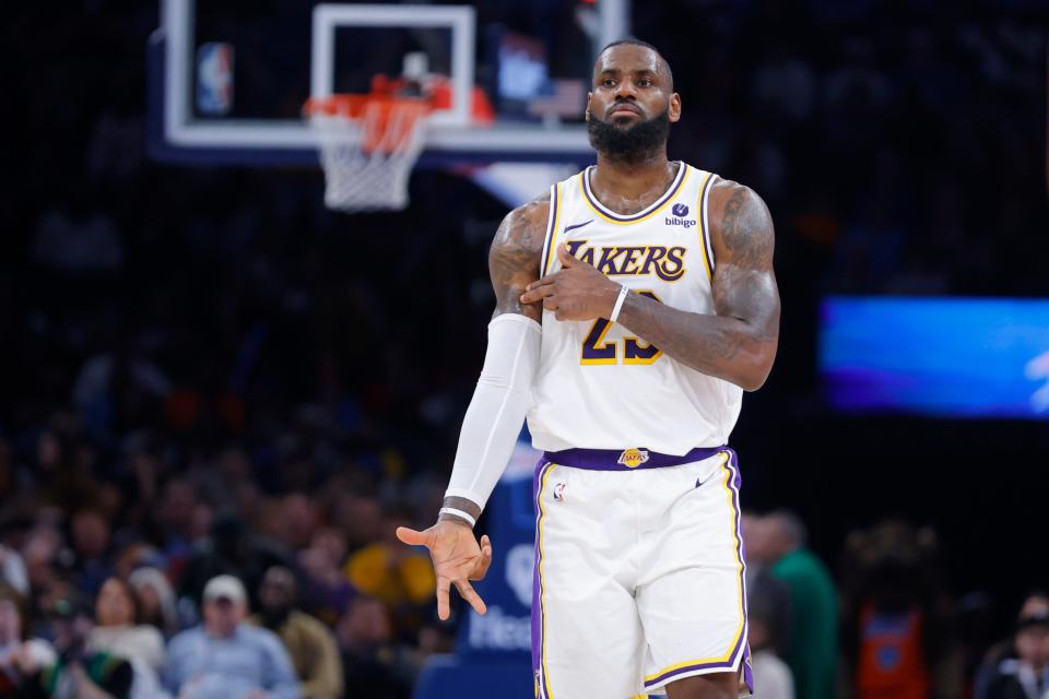 Lakers forward LeBron James (23) celebrates after making a shot against the Thunder on Saturday at Paycom Center.