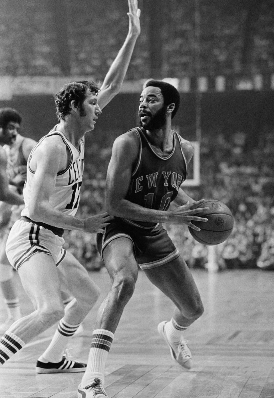 Boston Celtics’ John Havlicek, left, guards New York Knickerbockers’ Walt Frazier trying to make the corner, during their National Basketball Association playoff game on Wednesday, April 26, 1973 in Boston Garden. Havlicek, ailing from an injury to his right shoulder scored 18 points in the game. Boston won 98-97. New York leads the best-of-seven series 3-2. (AP Photo)
