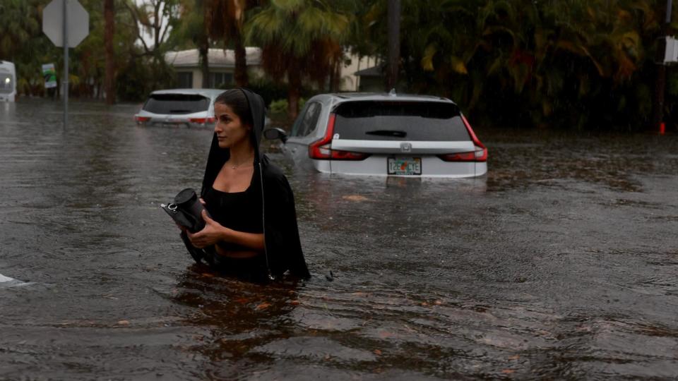 PHOTO: A person walks through a flooded street, June 12, 2024, in Hollywood, Fla. (Joe Raedle/Getty Images)