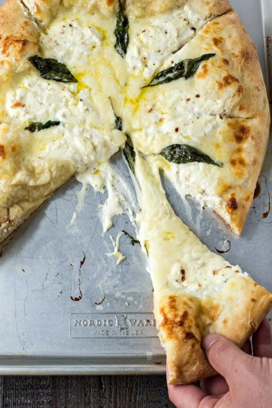 <p>Certified Pastry Aficionado</p><p>The best white pizza you will ever make! Made with store-bought dough, shredded mozzarella cheese, ricotta cheese, and Pecorino Romano cheese, this pizza is super simple to make and will be the best addition to your weeknight dinners.</p><p><strong>Get the recipe: <a href="http://www.certifiedpastryaficionado.com/best-pizza-bianca-white-pizza/" rel="nofollow noopener" target="_blank" data-ylk="slk:The Best Pizza Bianca (White Pizza);elm:context_link;itc:0;sec:content-canvas" class="link rapid-noclick-resp">The Best Pizza Bianca (White Pizza)</a></strong></p>