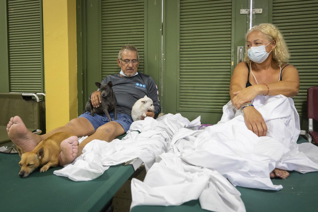 Residents affected by Hurricane Fiona rest at a school being used as a storm shelter in Salinas, Puerto Rico, Monday, Sept. 19, 2022.