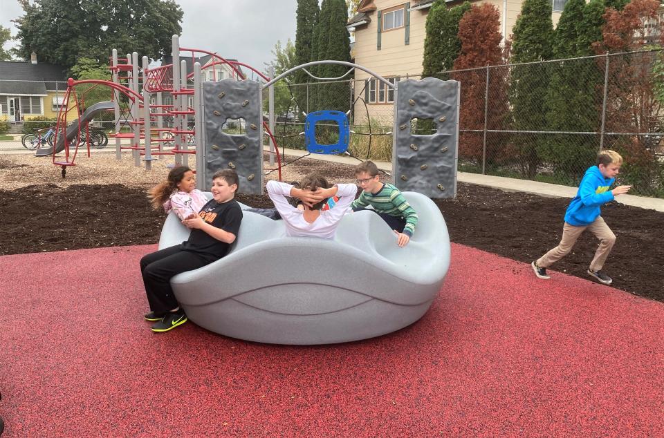 Students at STEM Academy in Fond du Lac make use of new playground equipment that accommodates every student. From left are: 
Amerakiss Cary, Parker Allen, Carter Bruno, Owen Wild and Hollis McDermott. Owen uses a wheelchair and the accessible playground was his school project this year.