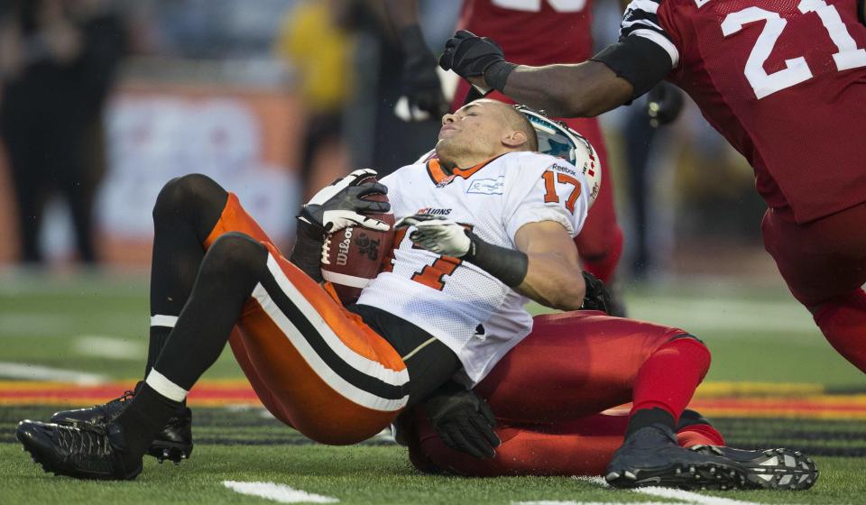 B.C. Lions slot back Nick Moore has his helmet knocked off during the Lions' loss to the Hamilton Tiger-Cats in CFL football action in Guelph, Ontario