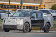 <p>Ford has trademarked the Maverick Lobo name, and it may point to this interesting new prototype, caught testing in Dearborn, Michigan. The heavy front-end camo appears to hide a more aggressive front-fascia, with a lowered, muscled stance. The prototype is fitted with new, larger 19-inch wheels. Expect this car in late 2024.</p>