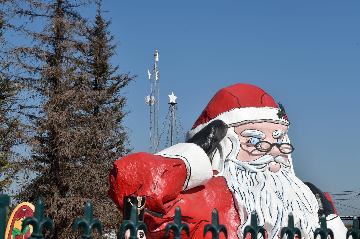 An internet antenna towers over the Santa Claus sculpture on Ventura Boulevard in Nyeland Acres on Jan. 25. The nonprofit Nyeland Promise and Rio School District have recently installed several towers in the unincorporated area near Oxnard to provide free internet access to 132 households with elementary and middle school children.