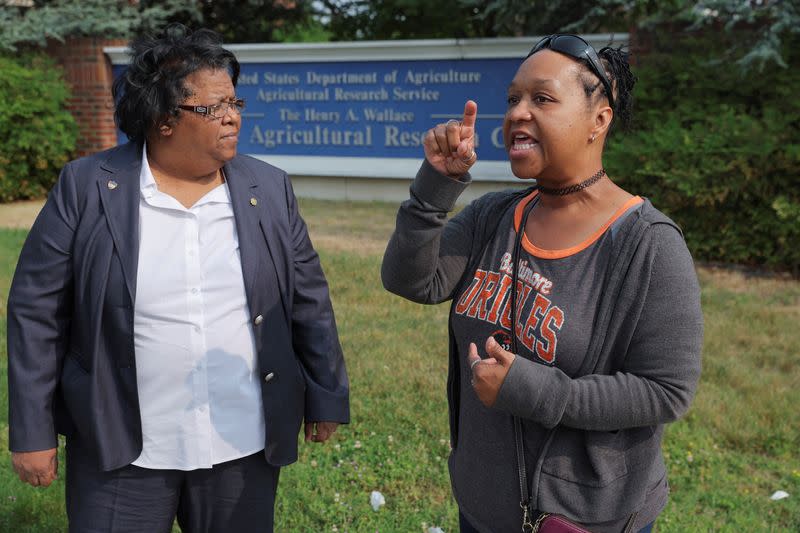 Employees filing federal complaint alleging unsafe work conditions stand outside USDA’s Beltsville Agricultural Research Center in Maryland