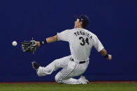 Japan's Masataka Yoshida cannot reach a ball hit by United States' Triston Casas during the seventh inning of a baseball game at the 2020 Summer Olympics, Monday, Aug. 2, 2021, in Yokohama, Japan. (AP Photo/Sue Ogrocki)