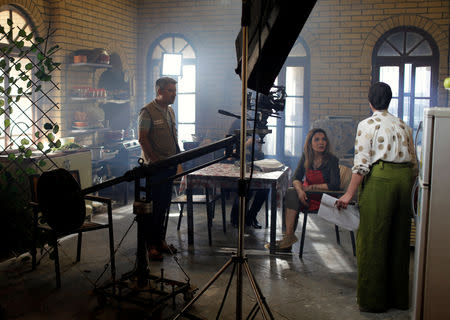 Iraqi actors prepare for a scene of Òthe hotelÓ TV series, which is being filmed and broadcast during the Muslim holy month of Ramadan, in Baghdad, Iraq May 12, 2019. Picture taken May 12, 2019. REUTERS/Thaier al-Sudani