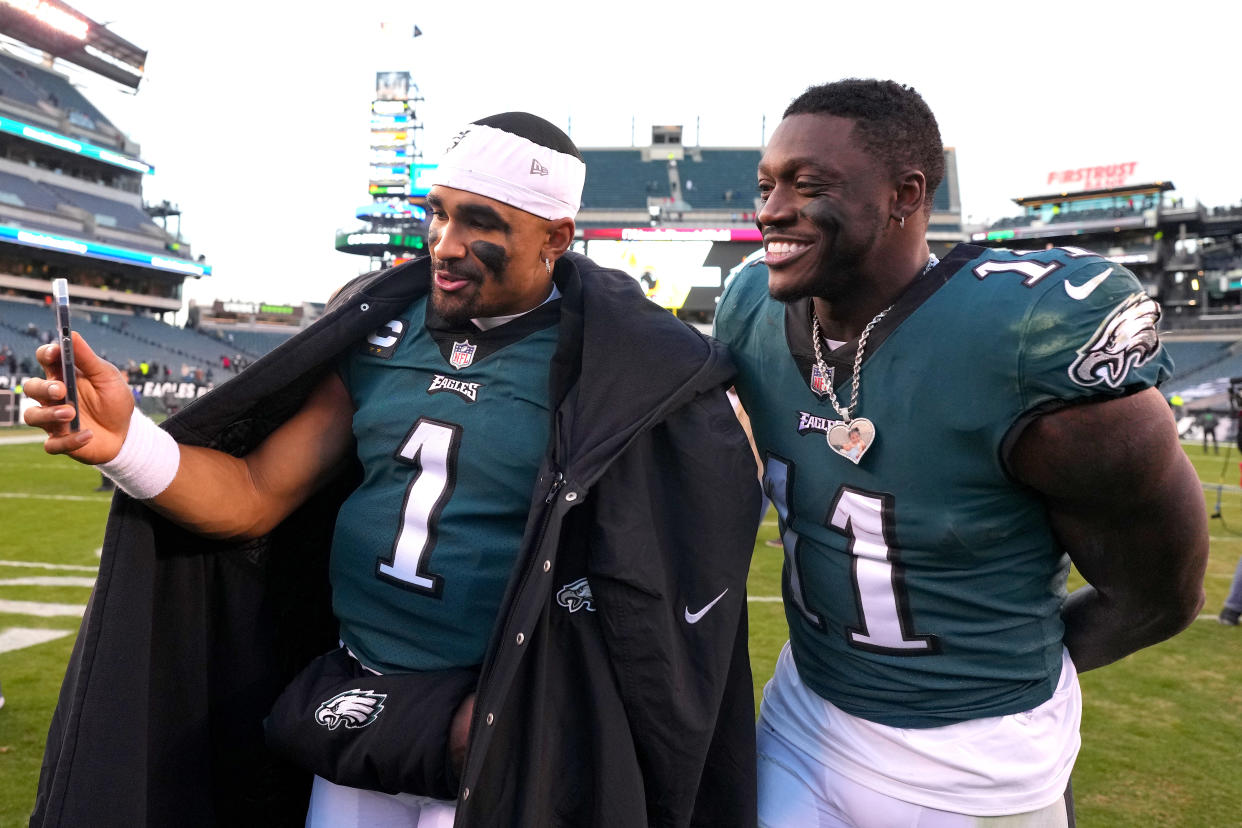 Now that Jalen Hurts (left) has a long-term extension with Philadelphia Eagles, he'll be able to link up with top target and friend AJ Brown (right) for years to come. (Photo by Mitchell Leff/Getty Images)